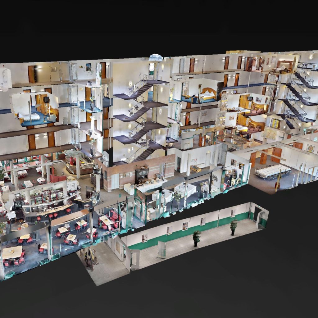 Vue dollhouse 3D multicouche d’un bâtiment montrant plusieurs étages et passerelles